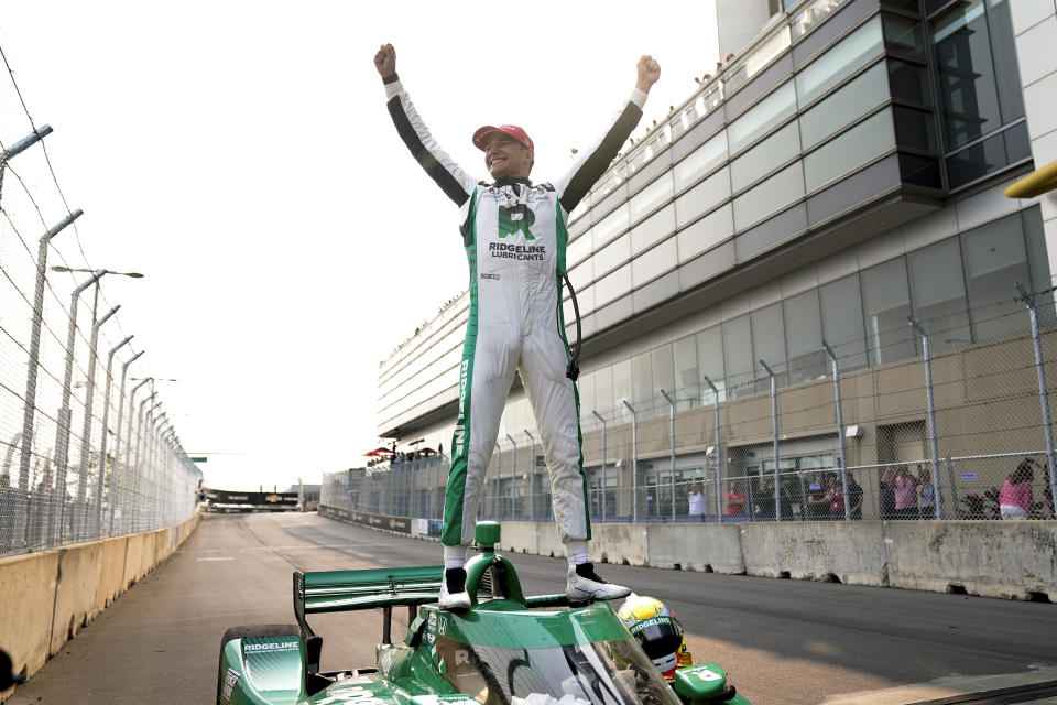 Alex Palou celebrates winning the IndyCar Detroit Grand Prix auto race in Detroit, Sunday, June 4, 2023. (AP Photo/Paul Sancya)