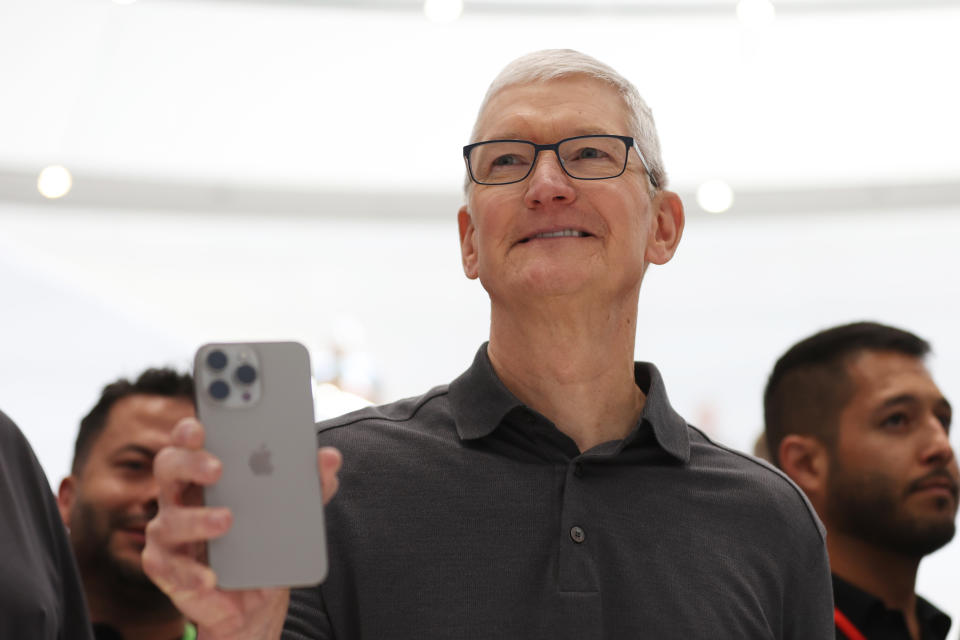 CUPERTINO, CA - SEPTEMBER 12: Apple CEO Tim Cook holds a new iPhone 15 Pro during an Apple event on September 12, 2023 in Cupertino, California.  Apple revealed its lineup of the latest iPhone 15 releases as well as other product upgrades during the event.  (Photo by Justin Sullivan/Getty Images)