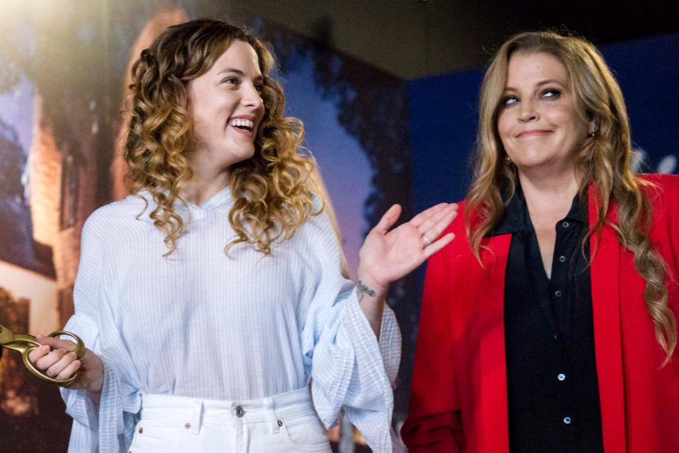 August 10, 2018 - Lisa Marie Presley, right, and her daughter Riley Keough participate in a private ribbon-cutting event for the new exhibit "Lisa Marie: Growing Up Presley" at Elvis Presley's Memphis entertainment complex.