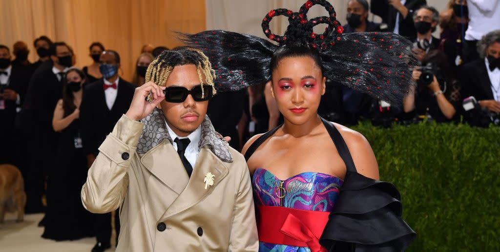 japanese tennis player naomi osaka r and us singer cordae arrive for the 2021 met gala at the metropolitan museum of art on september 13, 2021 in new york this years met gala has a distinctively youthful imprint, hosted by singer billie eilish, actor timothee chalamet, poet amanda gorman and tennis star naomi osaka, none of them older than 25 the 2021 theme is in america a lexicon of fashion photo by angela weiss afp photo by angela weissafp via getty images