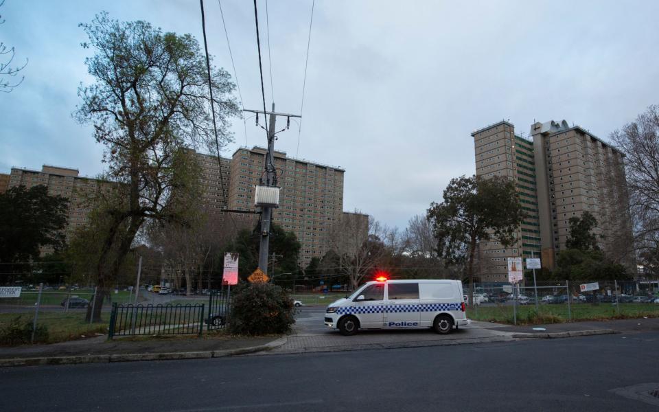 Police patrols are seen outside public housing towers on Racecourse Road in Flemington, Melbourne - DANIEL POCKETT/EPA-EFE/Shutterstock/Shutterstock