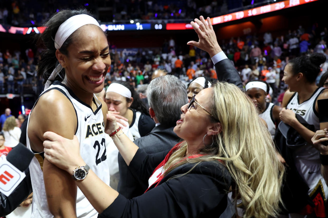 The Las Vegas Aces' A'ja Wilson and head coach Becky Hammon celebrate after defeating the Connecticut Sun to win the 2022 WNBA Finals at Mohegan Sun Arena in Uncasville, Connecticut, on Sept. 18, 2022. (Maddie Meyer/Getty Images)