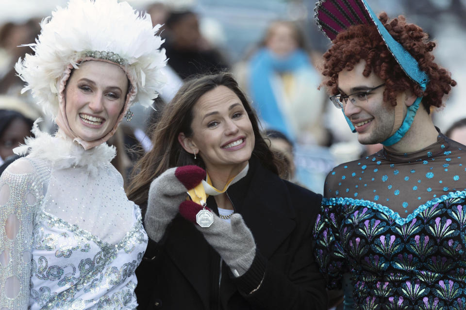 Members of Harvard University's Hasty Pudding Theatricals honor Jennifer Garner as "Woman of the Year" during a parade, Saturday, Feb. 5, 2022, in Cambridge, Mass. (AP Photo/Michael Dwyer)