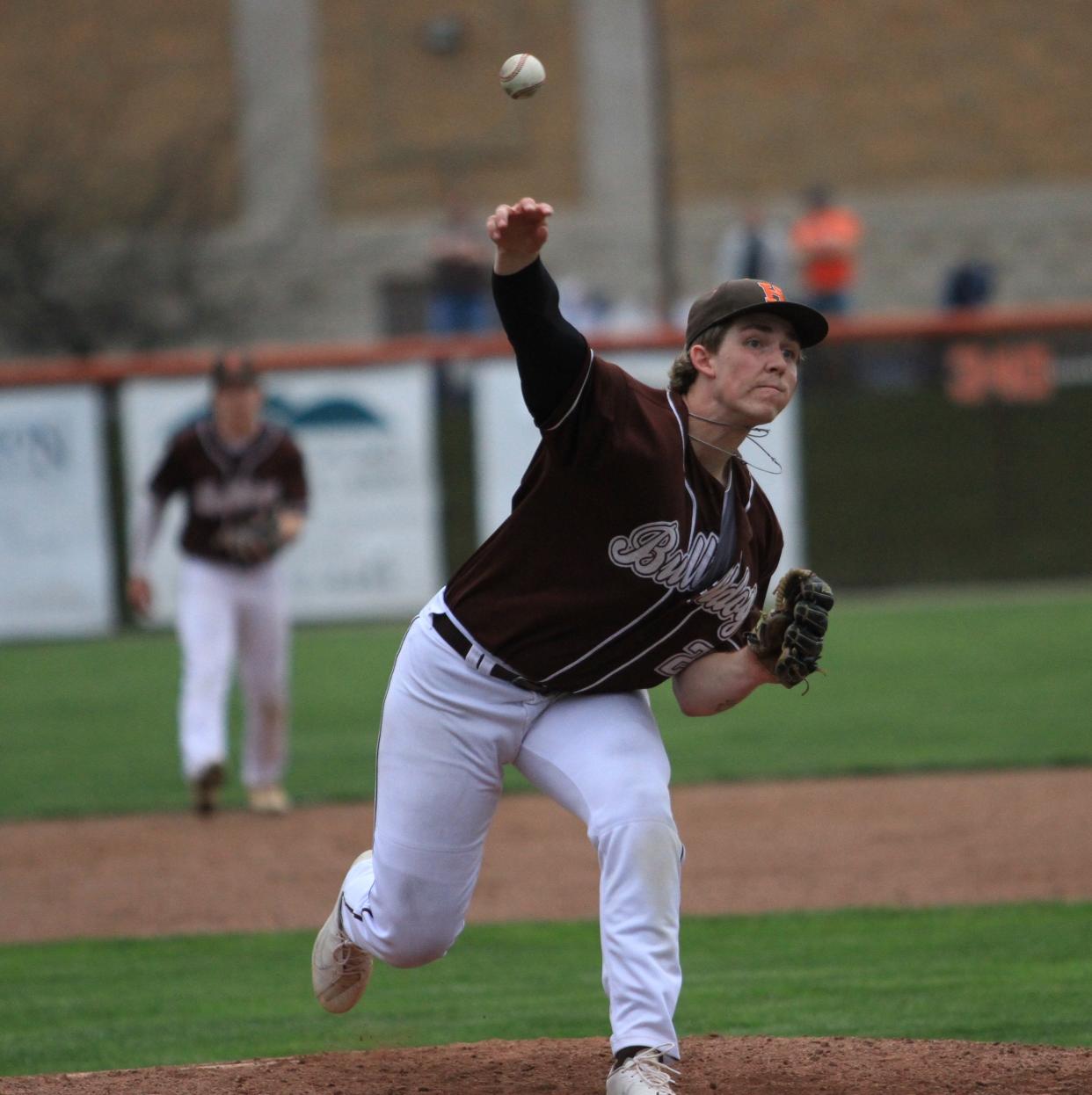 Heath's Hayden Woodward pitches against Newark Catholic during the host Bulldogs' 7-4 victory at Dave Klontz Field on Tuesday, April 9, 2024.