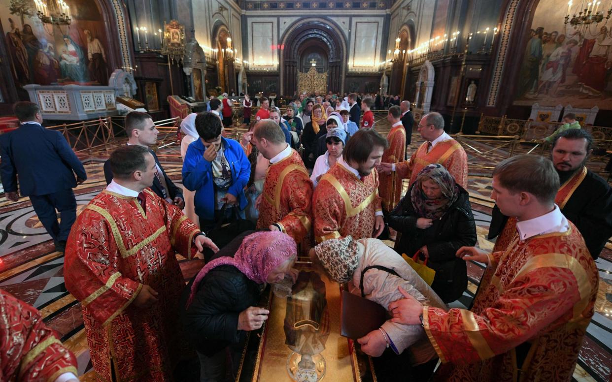 Russian Orthodox believers line up to kiss the relics of Saint Nicholas in the Christ the Saviour Cathedral in Moscow. The relics of one of the Russian Orthodox Church's most revered figures arrived in Moscow on May 21 from the Italian city of Bari. - AFP