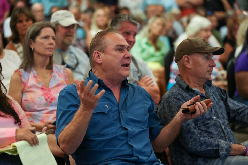 Casey Cass, Save our Salerno, asks a question during a town hall meeting with Martin County Commissioner Sarah Heard to discuss parking proposals and development in Port Salerno on Tuesday, Oct. 3, 2023, at the Port Salerno Civic Center, 4950 S.E. Anchor Ave. Many in attendance were part of the Save Our Salerno (S.O.S.) nonprofit and are opposed to real estate investor J. Corey Crowley's vision for Port Salerno.