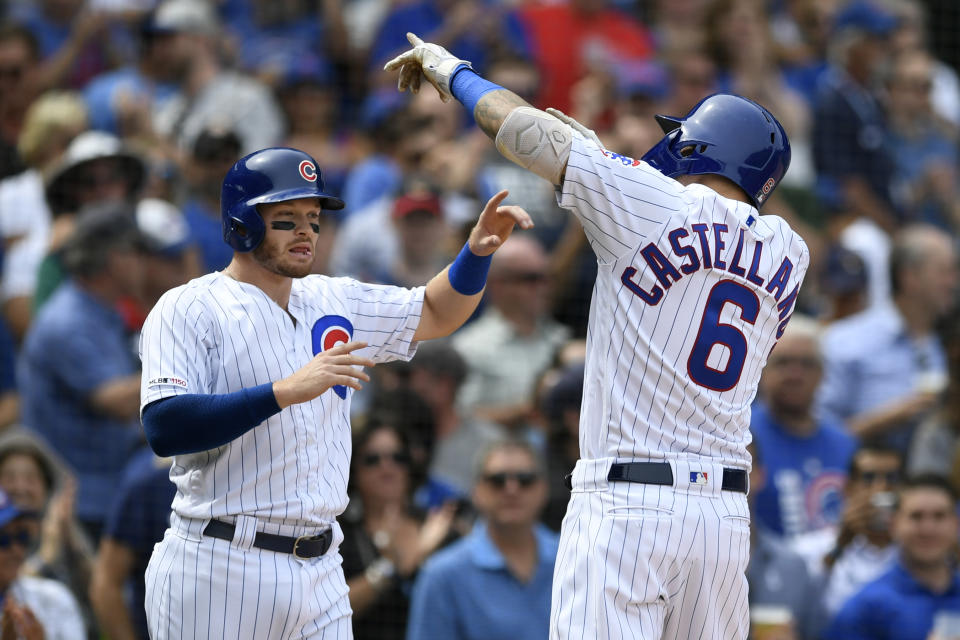 Chicago Cubs' Nicholas Castellanos (6) celebrates with teammate Ian Happ left, at home plate after hitting a two-run home run during the second inning of a baseball game against the Milwaukee Brewers Friday, Aug 30, 2019, in Chicago. (AP Photo/Paul Beaty)