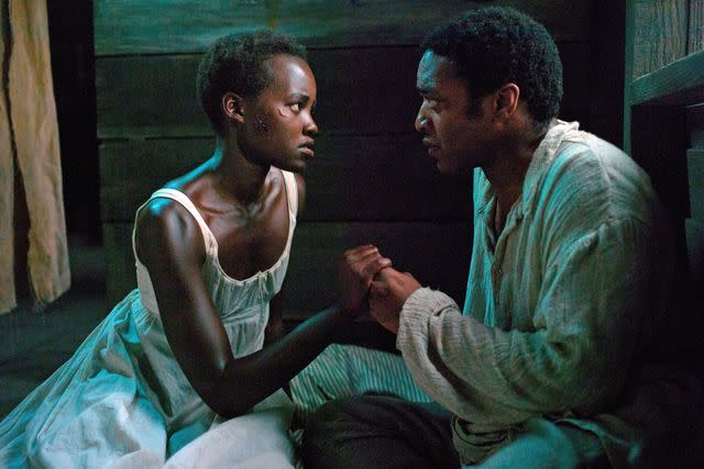 <p>Francois Duhamel/Fox Searchlight/Courtesy Everett Collection</p> Lupita Nyong'o and Chiwetel Ejiofor in '12 Years a Slave'