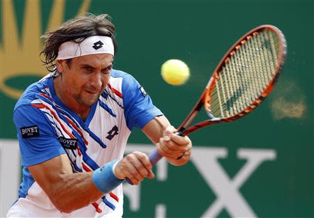 David Ferrer of Spain returns the ball to his compatriot Rafael Nadal during their quarter-final match at the Monte Carlo Masters in Monaco April 18, 2014. REUTERS/Eric Gaillard