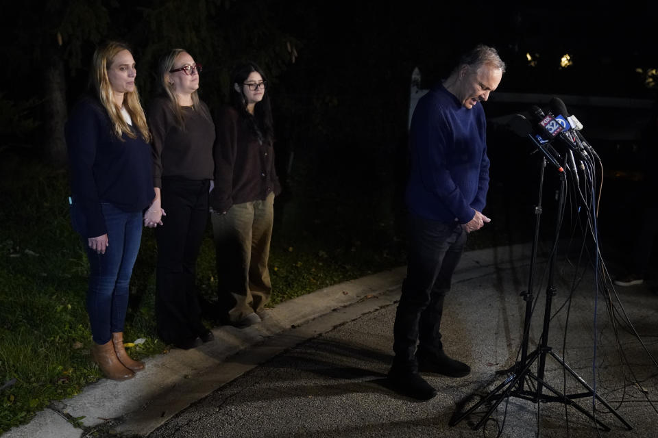 Uri Raanan, right, pauses as he talks to reporters outside his Bannockburn, Ill., home with his sister Sigal Zamir, left, wife Paola Raanan, center, and her daughter Frida Alonso, after his daughter Natalie, and her mother Judith Raanan were released by Hamas, Friday, Oct. 20, 2023. (AP Photo/Charles Rex Arbogast)