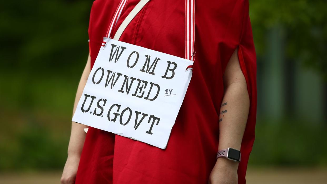 a person holding a sign