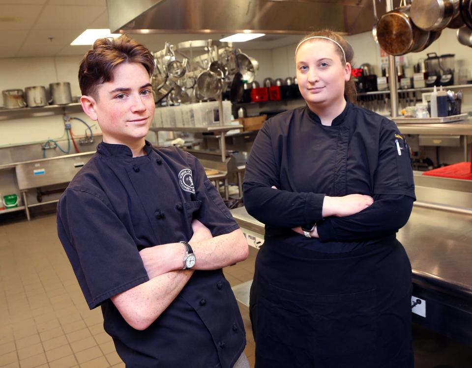 SST student Orion Raczek, who works at Vino e Vivo, won the SkillsUSA culinary arts state competition and will be going to nationals. He poses before class with his culinary arts instructor Margaret Forêt April 11, 2024.