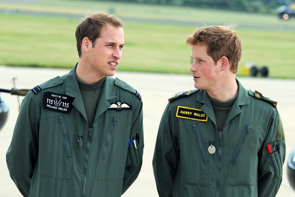 Prince William and Prince Harry attend a photocall during his military helecopter training course at RAF Shawbury on June 18, 2009 in Shawbury, England.