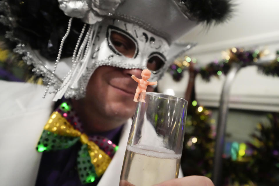 Members of the Mardi Gras group The Phunny Phorty Phellows revel on a street car for their annual kick off of the Mardi Gras season on Twelfth Night in New Orleans, Friday, Jan. 6, 2023. (AP Photo/Gerald Herbert)