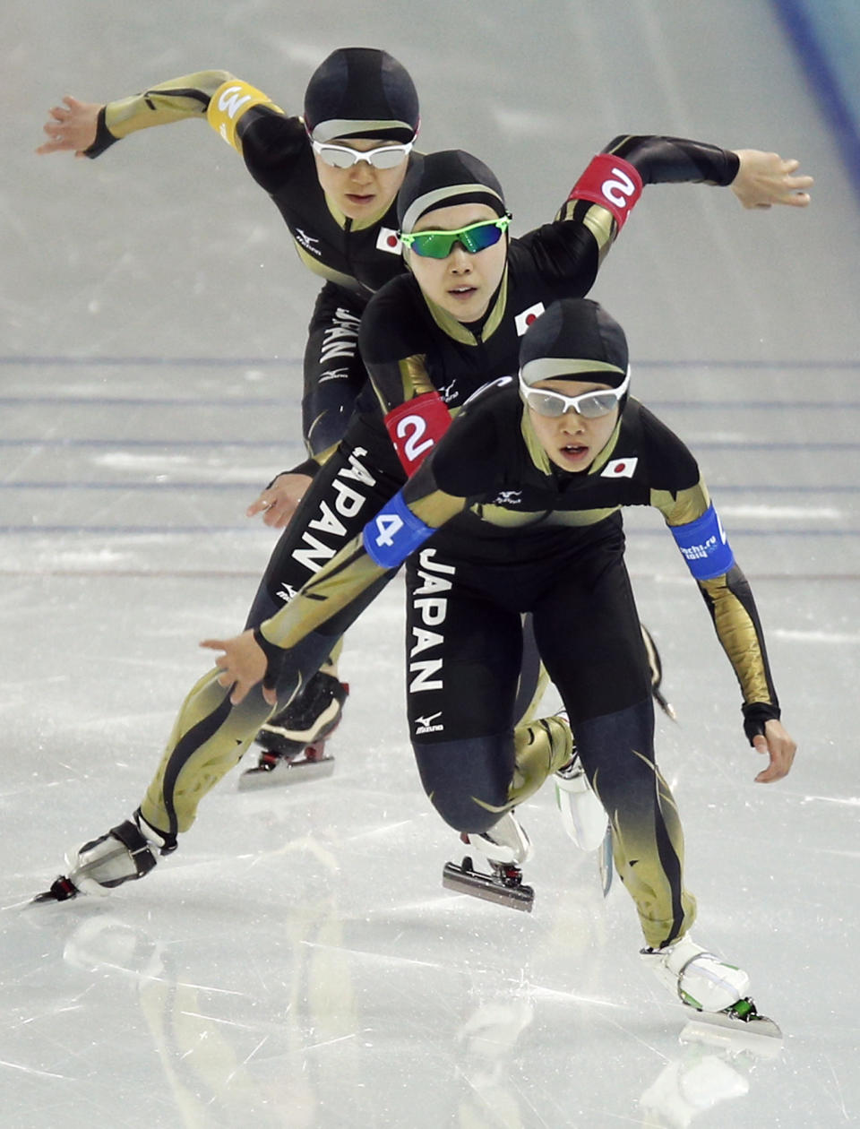 Nana Takagi, front, Misaki Oshigiri, center, and and Maki Tabata of Japan compete in the women's speedskating team pursuit quarterfinals at the Adler Arena Skating Center during the 2014 Winter Olympics in Sochi, Russia, Friday, Feb. 21, 2014. (AP Photo/Pavel Golovkin)