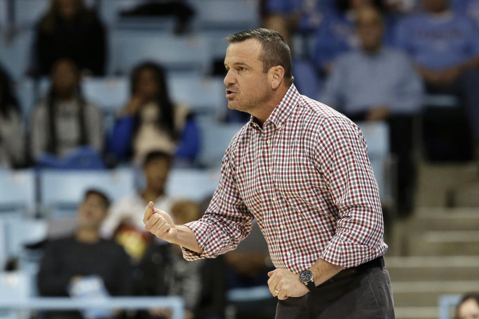 Louisville head coach Jeff Walz reacts during the first half of an NCAA college basketball game against North Carolina in Chapel Hill, N.C., Sunday, Jan. 19, 2020. (AP Photo/Gerry Broome)