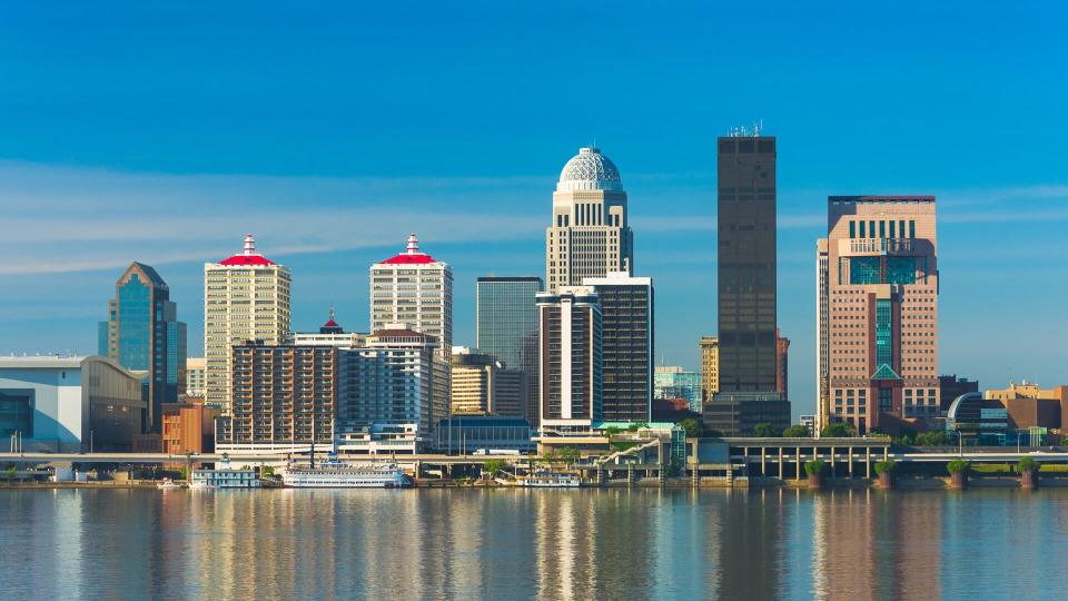 Downtown Louisville skyline with reflections on the Ohio River.