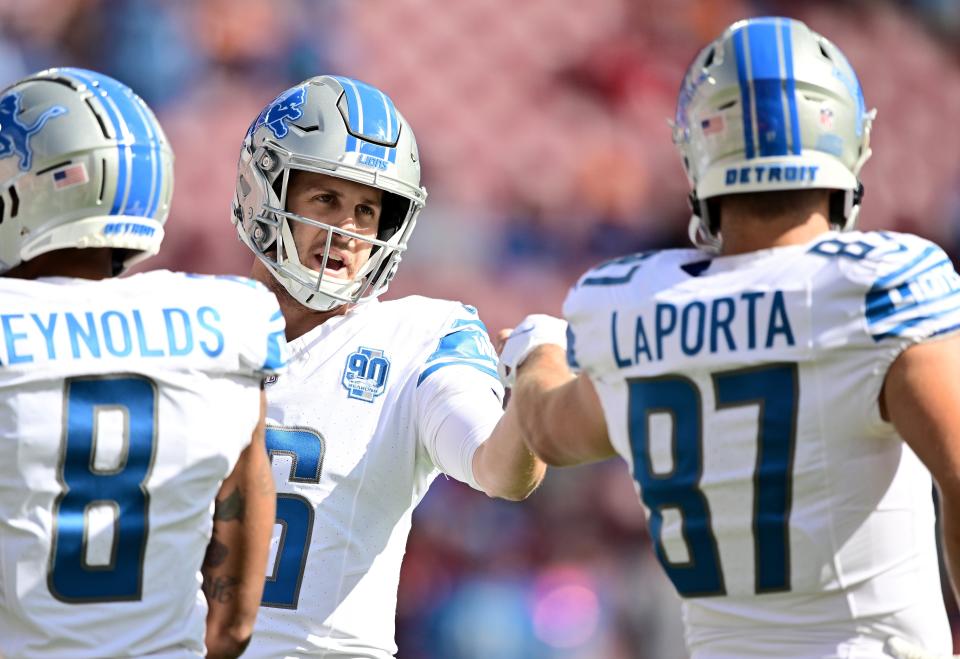 Lions quarterback Jared Goff talks to tight end Sam LaPorta prior to a game against the Buccaneers on Sunday, Oct. 15, 2023, in Tampa, Florida.