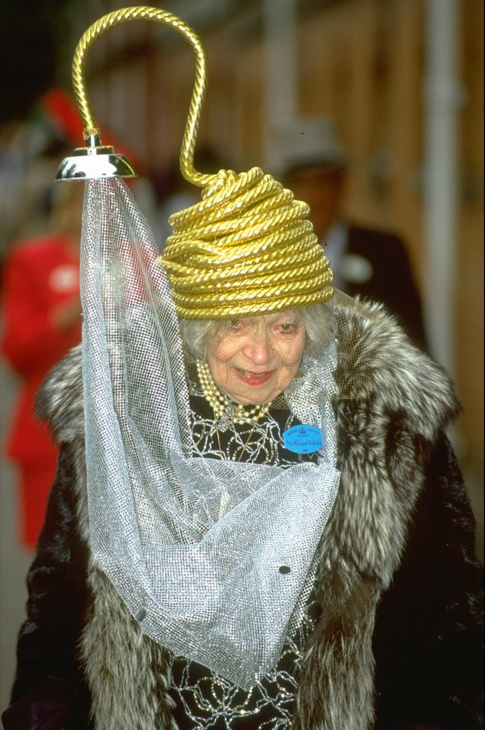 Gertrude Shilling at the 1996 Royal Ascot wearing a hat that resembles a shower.