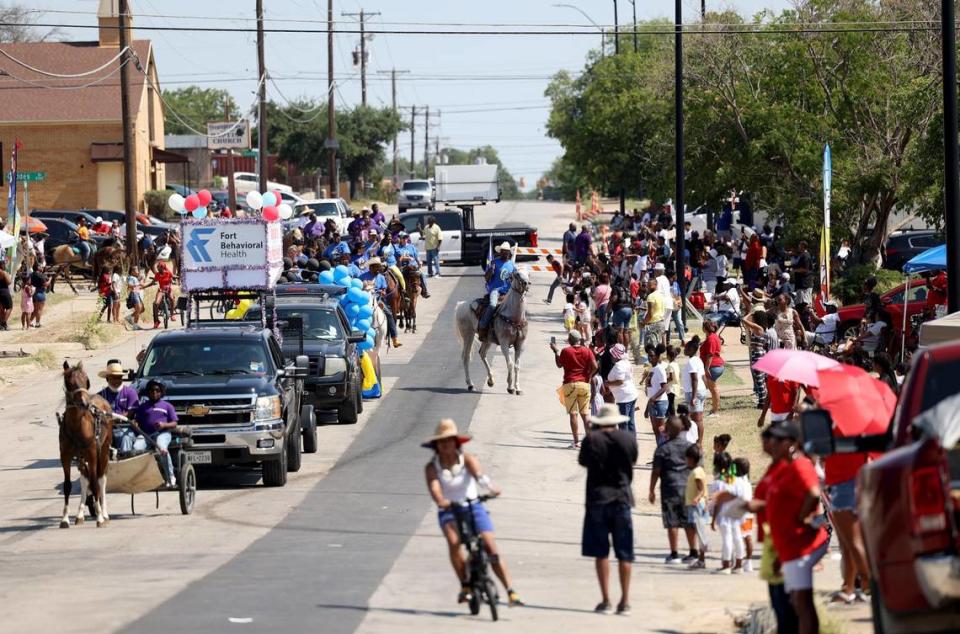 People gather for the annual Fourth of July parade in the Como neighborhood near the intersection of Diaz and Horne Streets. Three people were killed and eight wounded late Monday in a shooting during ComoFest. Amanda McCoy/amccoy@star-telegram.com