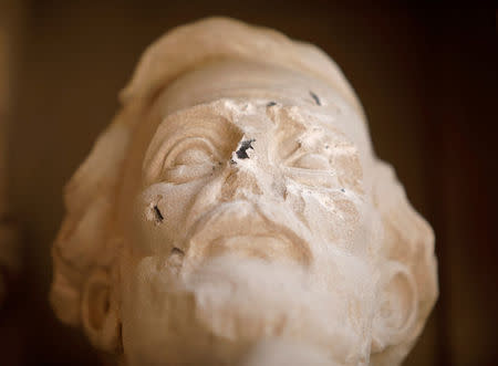 Damage done to the face of a statue of Confederate commander General Robert E. Lee is seen, at Duke University's Duke Chapel in Durham, North Carolina, U.S. on August 17, 2017. REUTERS/Jonathan Drake