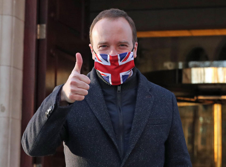 Heath Secretary Matt Hancock gives a thumbs up as he leaves Millbank in Westminster, central London, after the news that a Covid-19 vaccine from Oxford University and AstraZeneca has been approved for use in the UK, paving the way for a mass rollout. The jab, which has been described as a 