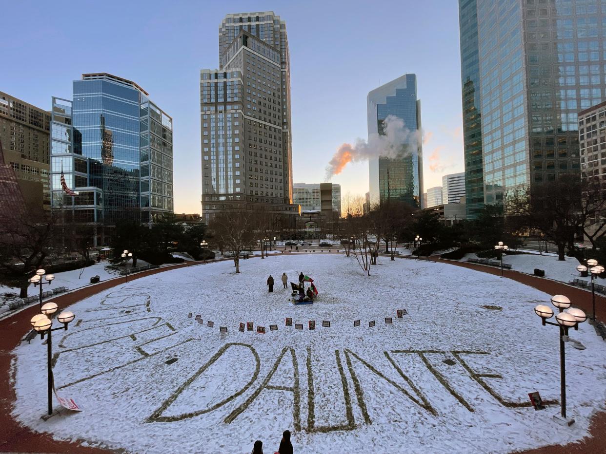 The name Daunte is written in the snow outside the Hennepin County Government Center in Minneapolis, Minn. on Dec. 22, 2021, during jury deliberations in the trial of former police officer Kim Potter.