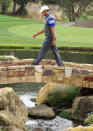 THOUSAND OAKS, CA - DECEMBER 02: Tiger Woods crosses a bridge on the 18th hole during the second round of the Chevron World Challenge at Sherwood Country Club on December 2, 2011 in Thousand Oaks, California. (Photo by Scott Halleran/Getty Images)