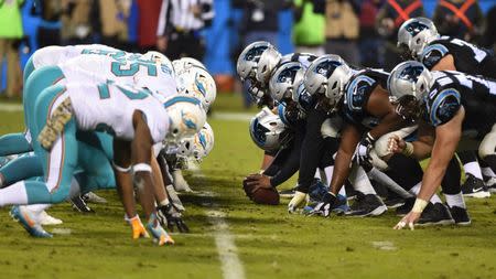 Nov 13, 2017; Charlotte, NC, USA; Miami Dolphins and Carolina Panthers at the line in the fourth quarter. The Panthers defeated the Dolphins 45-21 at Bank of America Stadium. Bob Donnan-USA TODAY Sports