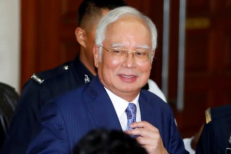 FILE PHOTO: Former Malaysia's Prime Minister Najib Razak leaves Kuala Lumpur High Court in Kuala Lumpur