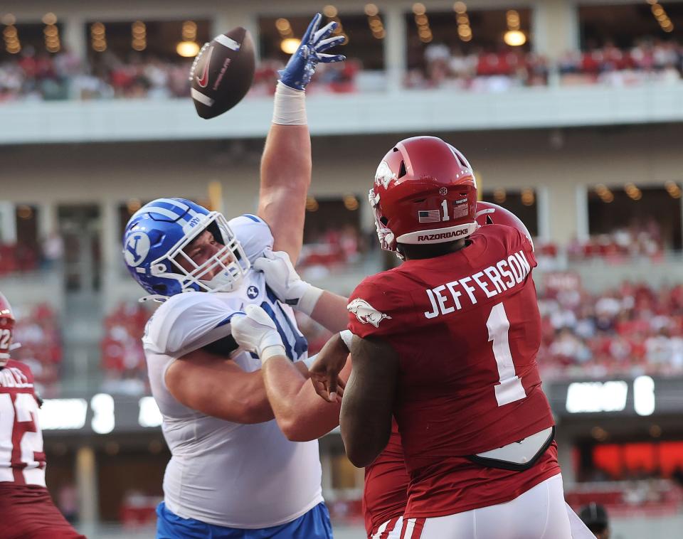 Brigham Young Cougars defensive tackle Jackson Cravens (91) blocks the pass by Arkansas Razorbacks quarterback KJ Jefferson (1) at Razorback Stadium in Fayetteville on Saturday, Sept. 16, 2023. | Jeffrey D. Allred, Deseret News