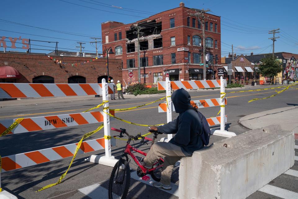 Steve Jackson of Detroit looks on Monday, Sept. 18, 2023 at a building that partially collapsed in Eastern Market on Saturday.