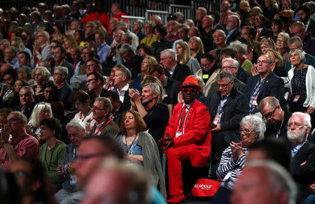 Delegates listen to the Labour Party's Shadow Secretary of State for Departing the European Union Keir Starmer speak at his party's conference in Liverpool, Britain, September 25, 2018. REUTERS/Hannah McKay