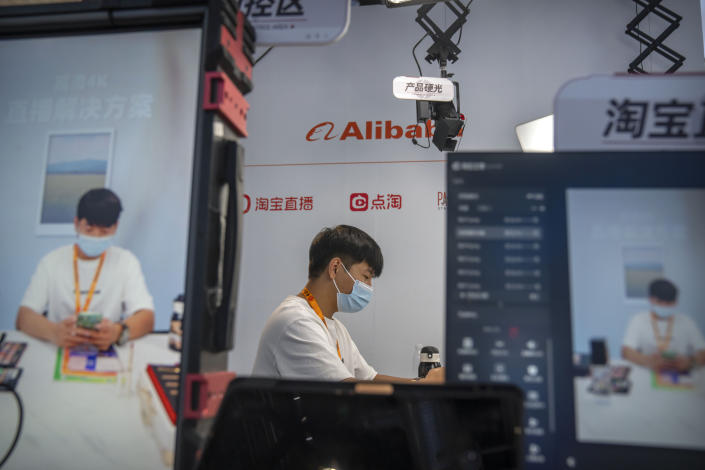 FILE - A staff member prepares to demonstrate live streaming at a booth from Chinese technology firm Alibaba at the China International Fair for Trade in Services (CIFTIS) in Beijing, on Sept. 2, 2022. A grinding crackdown that wiped billions of dollars of value off Chinese technology companies is easing, but the once-freewheeling industry is bracing for much slower growth ahead. (AP Photo/Mark Schiefelbein, File)