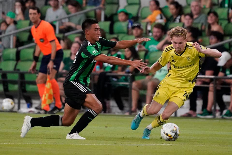 Nashville SC forward Jacob Shaffelburg dribbles while being defended by Austin FC midfielder Owen Wolff during the 1-1 draw at Q2 Stadium on Saturday night. With the tie, Austin clinched a home playoff game in October.