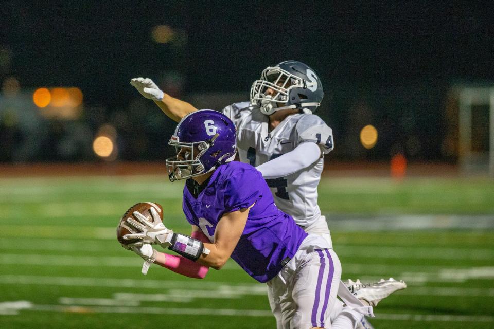RFH's Nick Rigby catches a pass as Middletown South's Anthony Puccio tries to block it during the first half of the Middletown South vs. Rumson-Fair Haven high school football game at Rumson-Fair Haven High School in Rumson, NJ Friday, October 7, 2022. 
