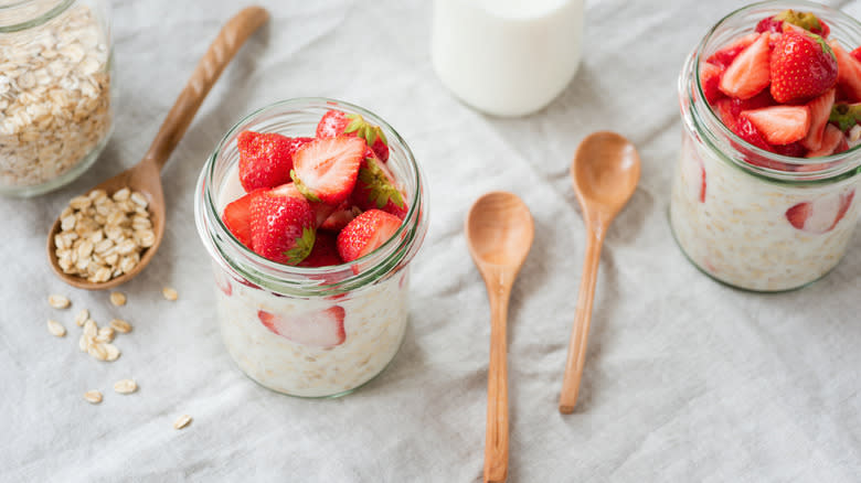 overnight oats jars, milk, spoons