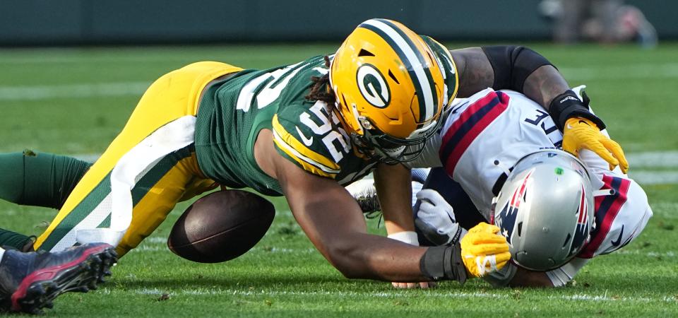 Packers linebacker Rashan Gary (52) forces a fumble by Patriots quarterback Bailey Zappe during the second quarter of Sunday's game. Zappe was making his NFL debut after Brian Hoyer was forced from the game because of a head injury. Green Bay won in overtime, 27-24.