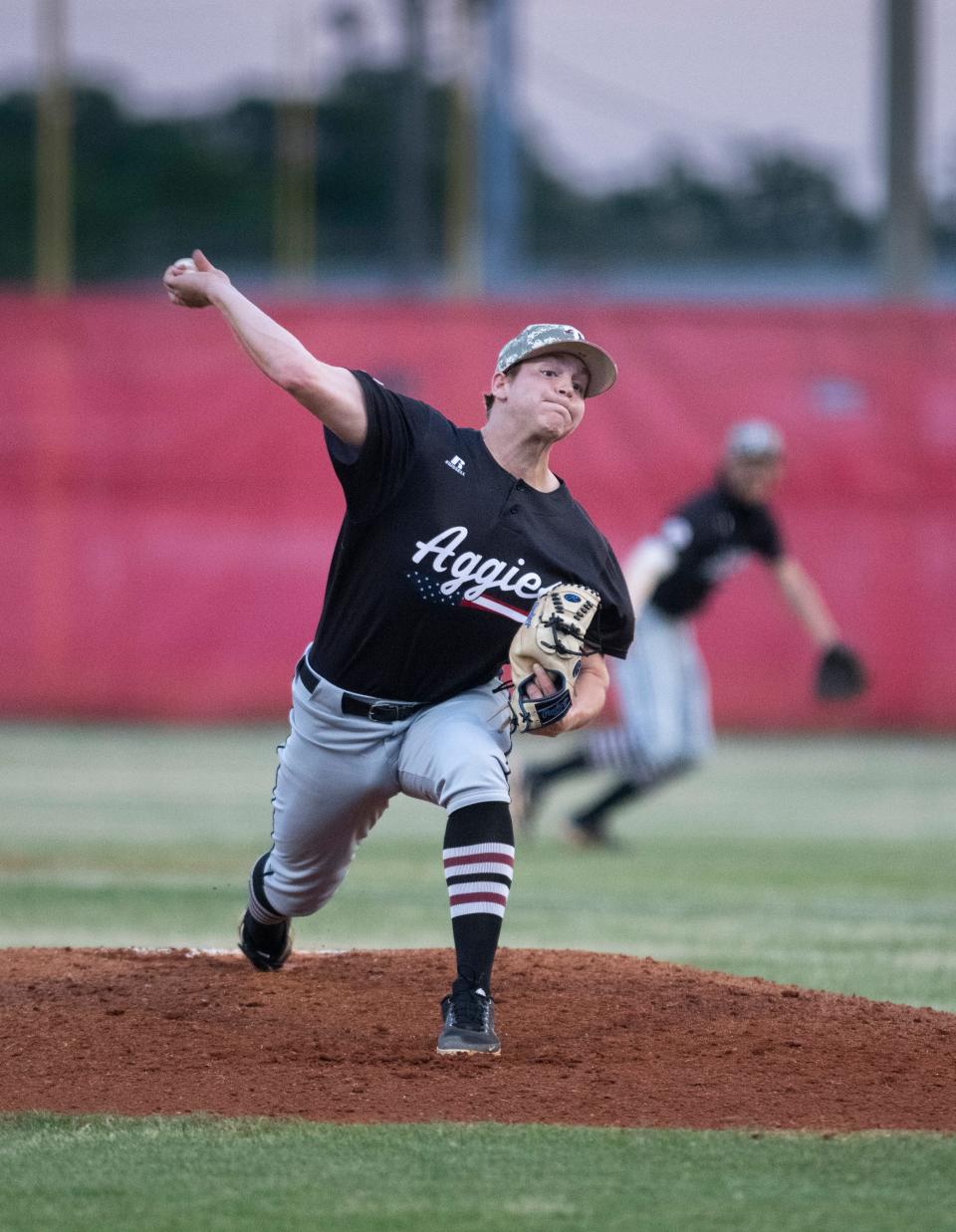 Josiah Glodfelter (6) pitches during the Tate vs Pace baseball game at Pace High School on Friday, April 15, 2022.