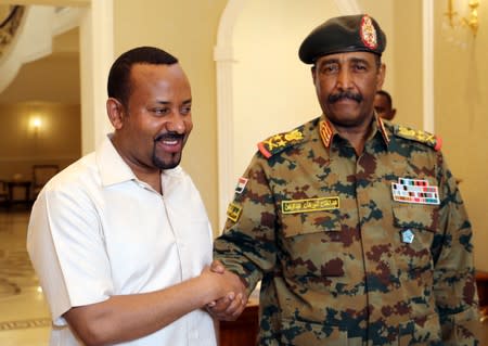 Ethiopian Prime Minister Abiy Ahmed meets Sudan's Head Of Transitional Military Council, Lieutenant General Abdel Fattah Al-Burhan Abdelrahman to mediate in the political crisis at the airport in Khartoum