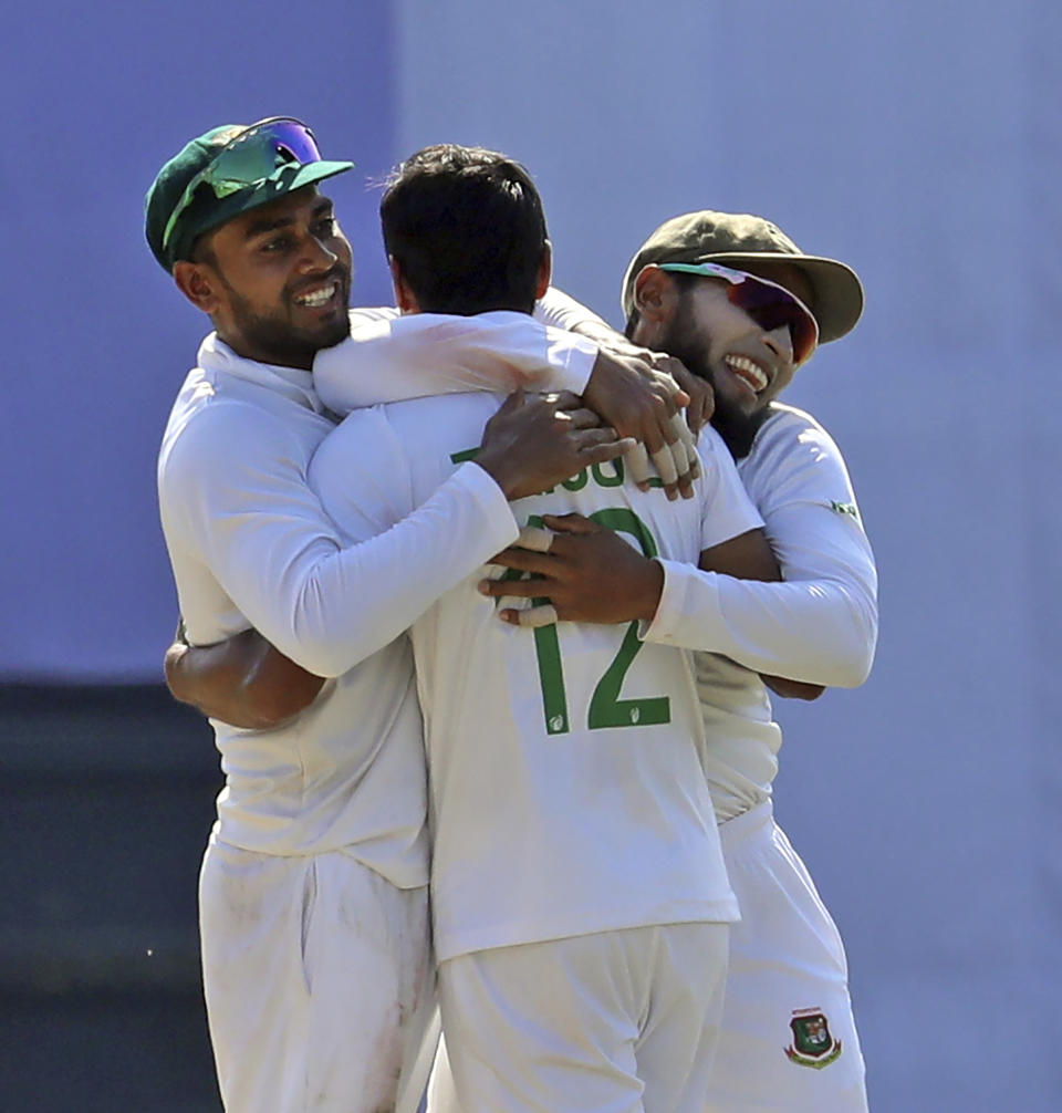 Bangladeshi cricketers celebrate the dismissal of New Zealand's Ish Sodhi during the fifth day of the first test cricket match at Sylhet, Bangladesh, Saturday, Dec. 2, 2023. (AP Photo/Mosaraf Hossain)
