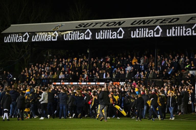 Pitch invasion by Sutton fans after the English FA Cup fifth round football match on February 20, 2017