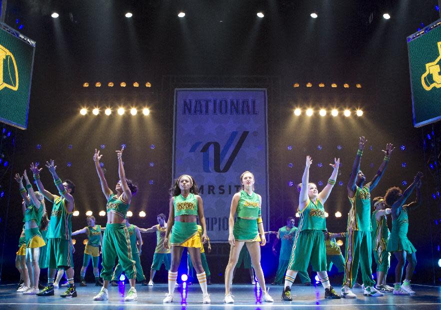 This theater image released by The Hartman Group shows Adrienne Warren, center left, and Taylor Louderman, center right, during a performance of "Bring It On: The Musical," at the St. James Theatre in New York. (AP Photo/The Hartman Group, Joan Marcus)