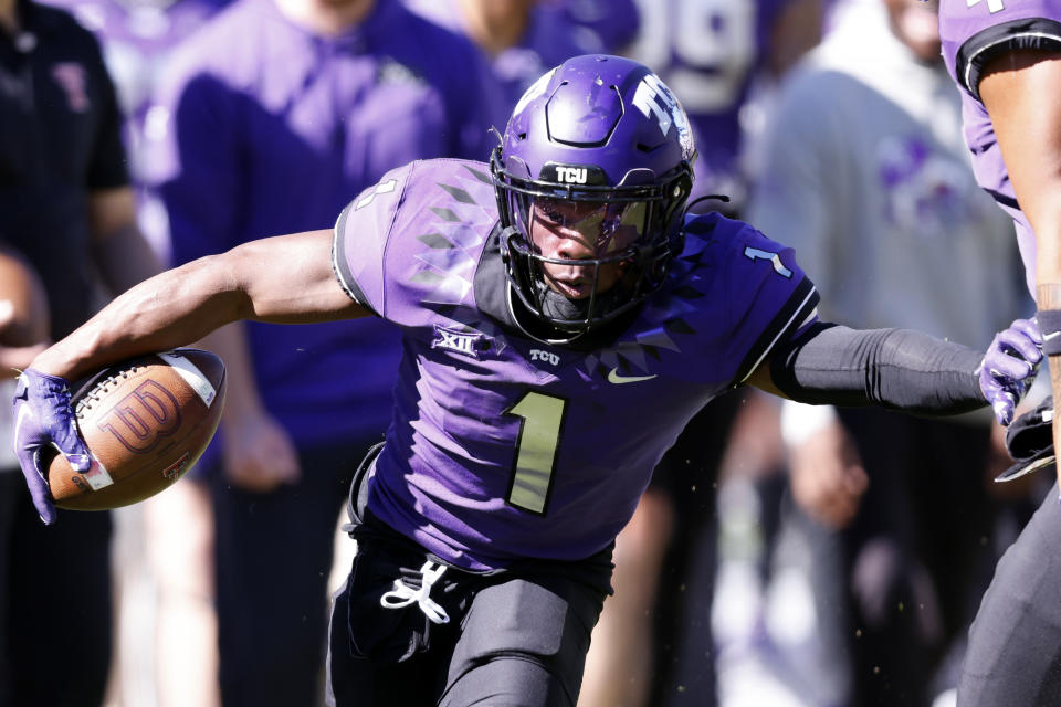 FILE - TCU cornerback Tre'Vius Hodges-Tomlinson (1) returns an interception against Texas Tech during the second half of an NCAA college football game Saturday, Nov. 5, 2022, in Fort Worth, Texas. Hodges-Tomlinson was selected to The Associated Press All-America team released Monday, Dec. 12, 2022. (AP Photo/Ron Jenkins, File)