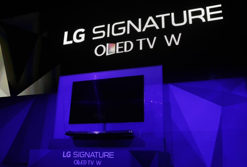 The LG Signature OLED TV W is unveiled during an LG news conference before CES International, Wednesday, Jan. 4, 2017, in Las Vegas. (AP Photo/John Locher)