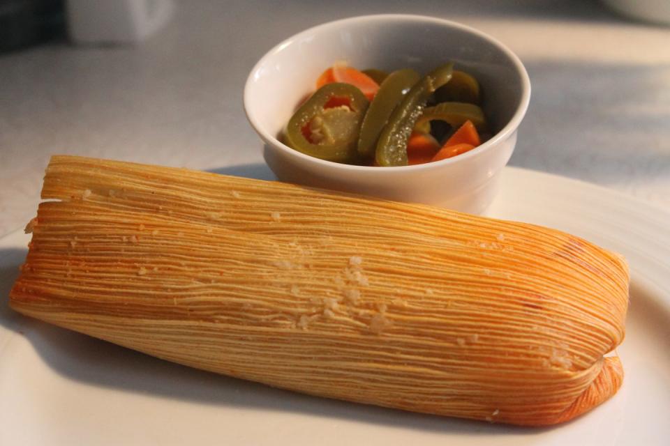 <p>Tamales are a very important traditional <a href="https://www.godutchrealty.com/costa-rica-real-estate-blog/how-to-prevent-culture-shock/traditional-costa-rican-christmas-food/" rel="nofollow noopener" target="_blank" data-ylk="slk:Costa Rican Christmas food;elm:context_link;itc:0;sec:content-canvas" class="link ">Costa Rican Christmas food</a>. Tamales are eaten year-round now, but traditionally, they were only made for Christmas. The ingredients can vary depending on each family's preferred recipe, but they're usually made with a mix of ground corn, pork, carrots, rice, sweet pepper, and achiote, then wrapped in a plantain leaf and cooked. Other dishes include <em>rompope</em>, a homemade eggnog; <em>pierna de cerdo asada</em>, or roast pork; and <em>El Queque Navideño, </em>a Christmas cake made of rum and candied fruit. </p>