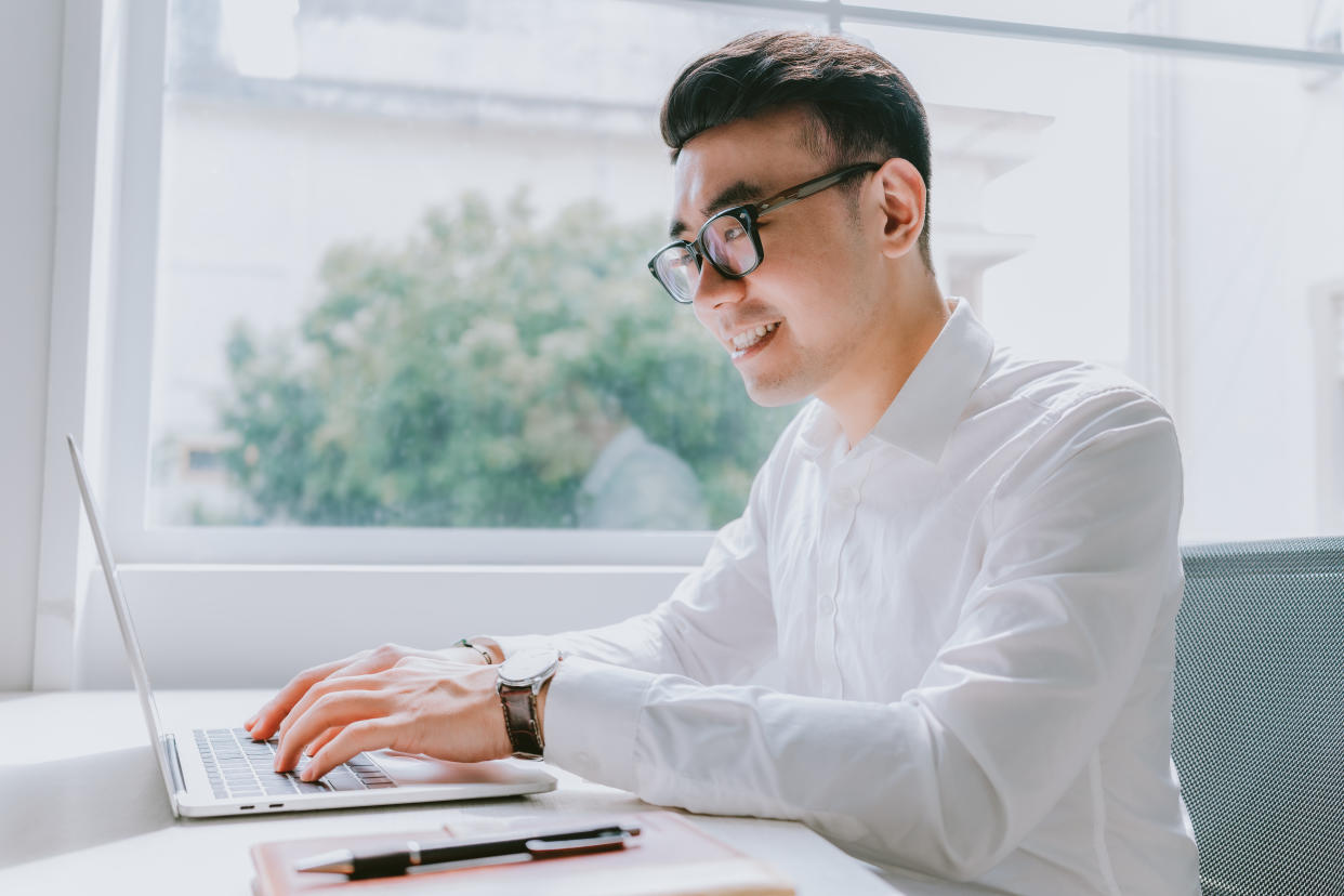 Young Asian businessman working at office