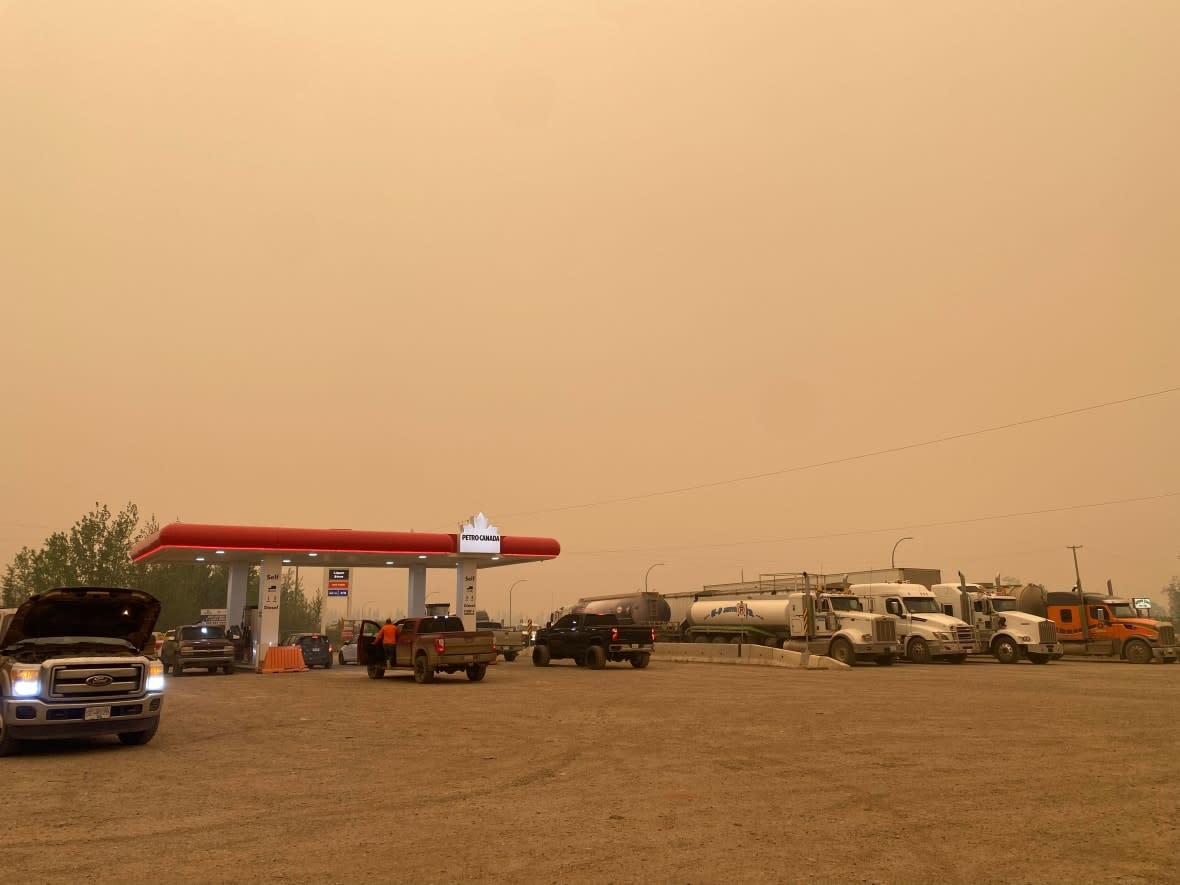 Drivers fill up at a gas station in Wonowon, B.C., about 100 kilometres north of Fort St. John. (Submitted by Y.C. Kim - image credit)