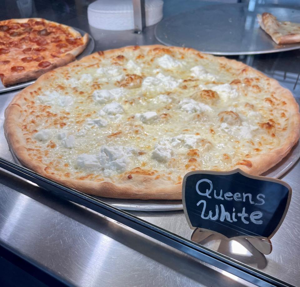 A Queens white pizza is ready to be sold by the slice at Grado's in Cape Coral.
