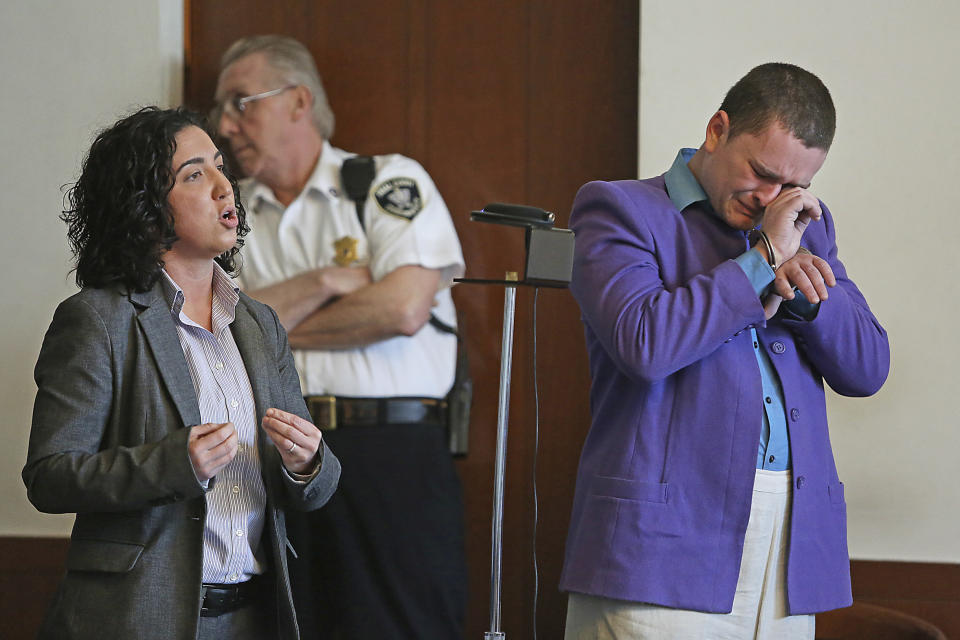 Kevin Edson cries during a hearing as he stands beside his attorney, Shannon Lopez, left, in Municipal Court Wednesday, May 7, 2014 in Boston. Edson, accused of a bomb hoax near the Boston Marathon finish line on the anniversary of the 2013 bombing anniversary, was found mentally competent for trial after being evaluated at a state hospital following his April 15 arrest. (AP Photo/Boston Herald, John Wilcox, Pool)